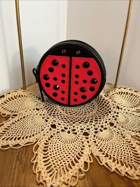 kate spade Black and Red Round Coin Purse with Cutout Dots